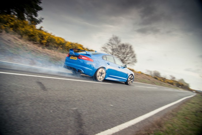 2014 Jaguar XFR-S Review - Burnout Rear Angle - carwitter